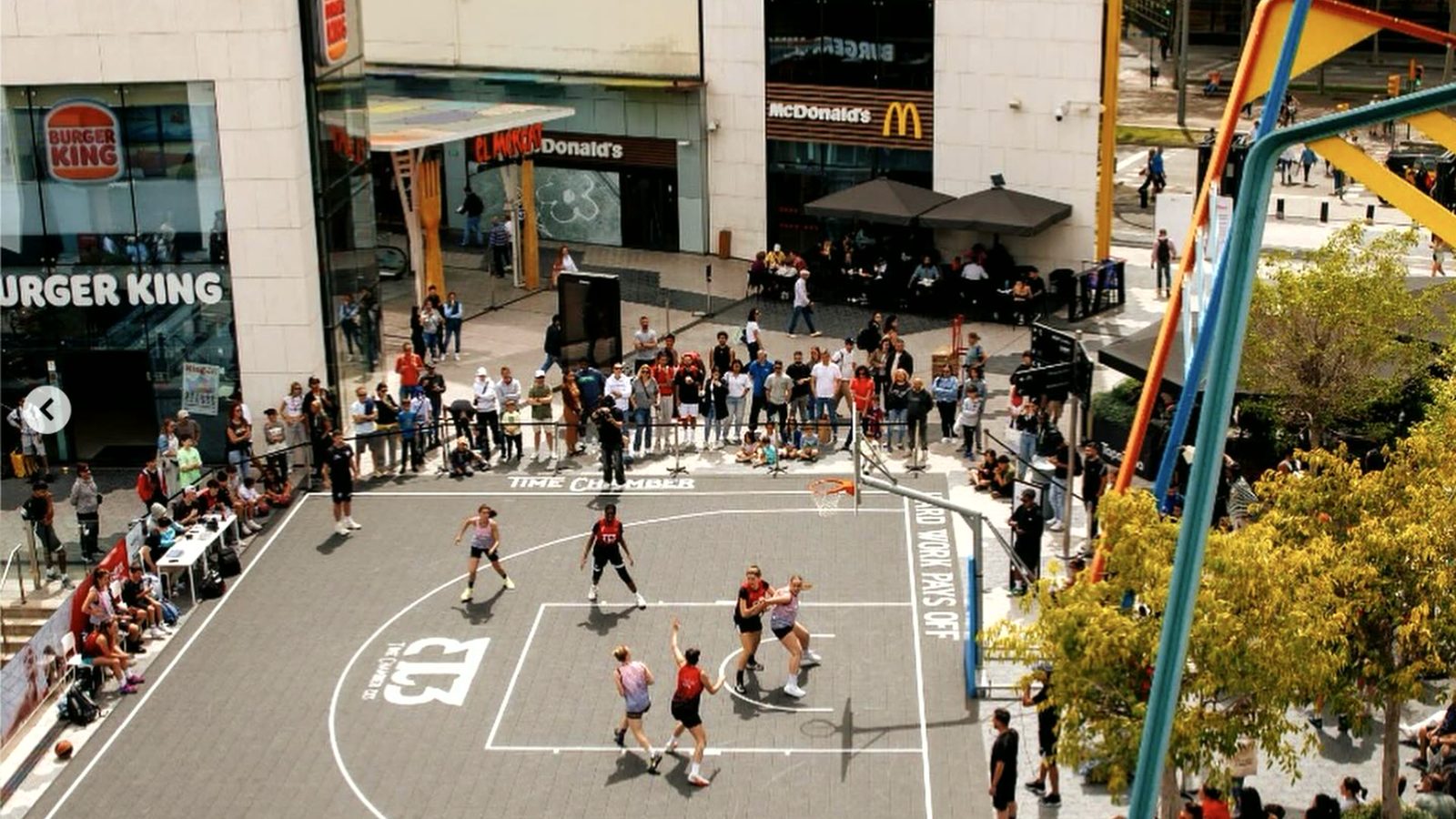 Women's 3x3 game on the Westfield Glòries court, with the Time Chamber logo painted on the floor
