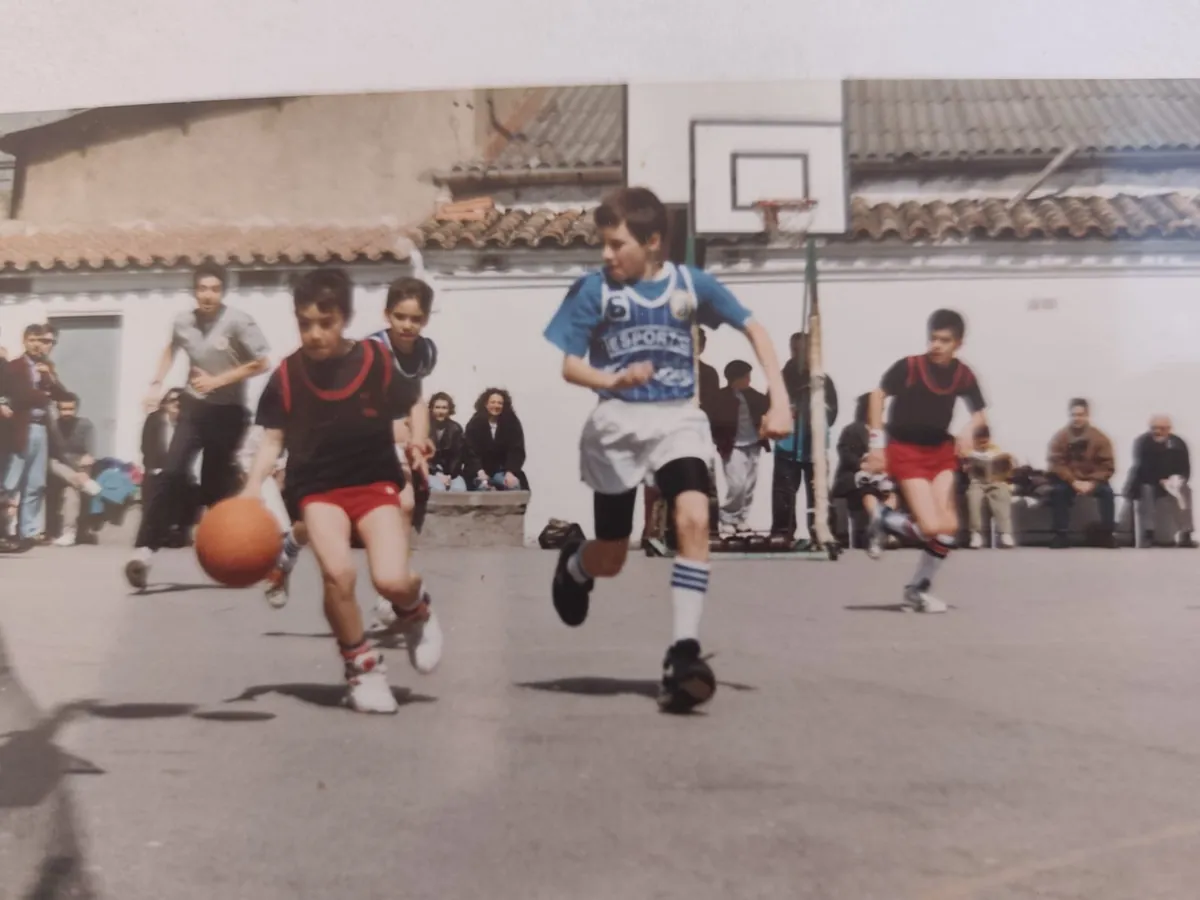 Basketball match on a playground court in the 90s